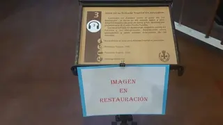 Cartel que anuncia la restauración de La Borriquita