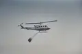 Un helicóptero trabaja en las labores de extinción del incendio, a 24 de julio de 2026, en Burgohondo, Ávila, Castilla y León (España)- Mateo Lanzuela - Europa Press